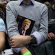 A member of the crowd holds a copy of Time magazine as President-elect Donald Trump speaks at the DeltaPlex Arena, December 9, 2016 in Grand Rapids, Michigan.